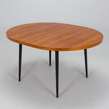 A mid-20th century dining table.