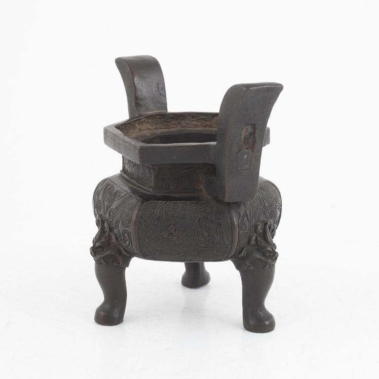 A Chinese bronze tripod censer, Ming dynasty (1368-1643).