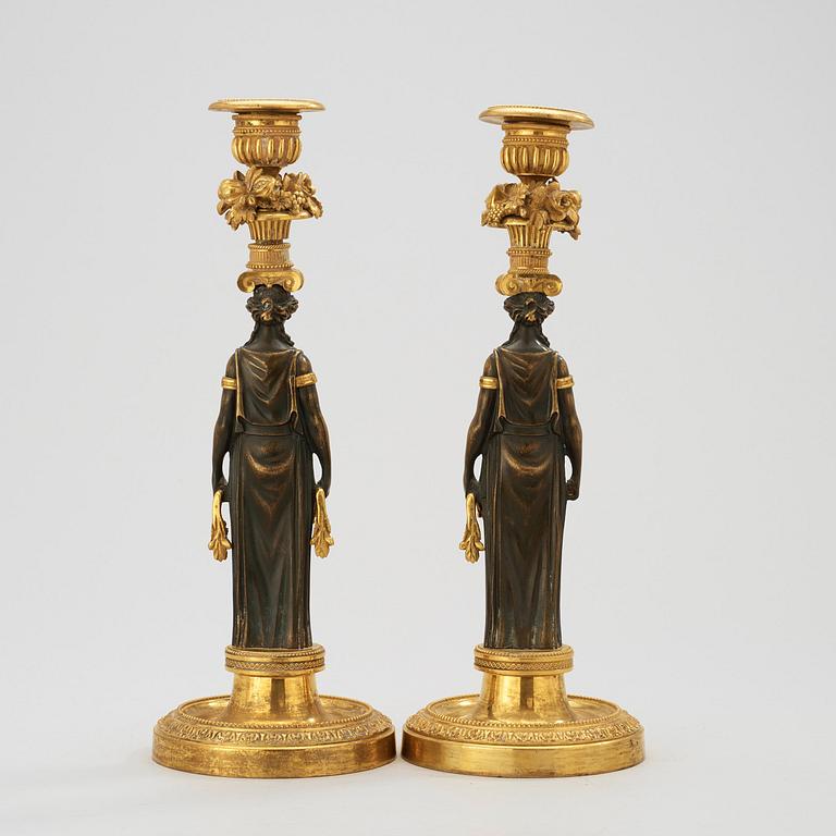 A pair of Empire early 19th century candlesticks.