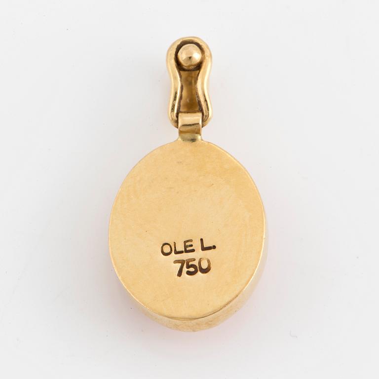 An Ole Lyngaard 18K gold and coral pendant.