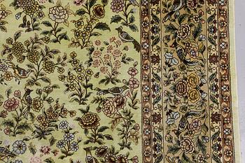 An Oriental silk rug, approx. 124 x 183 cm.