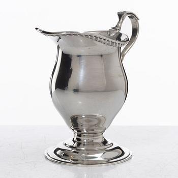 A silver cream jug, mark of S W Smith & Co, Birmingham, England 1929.