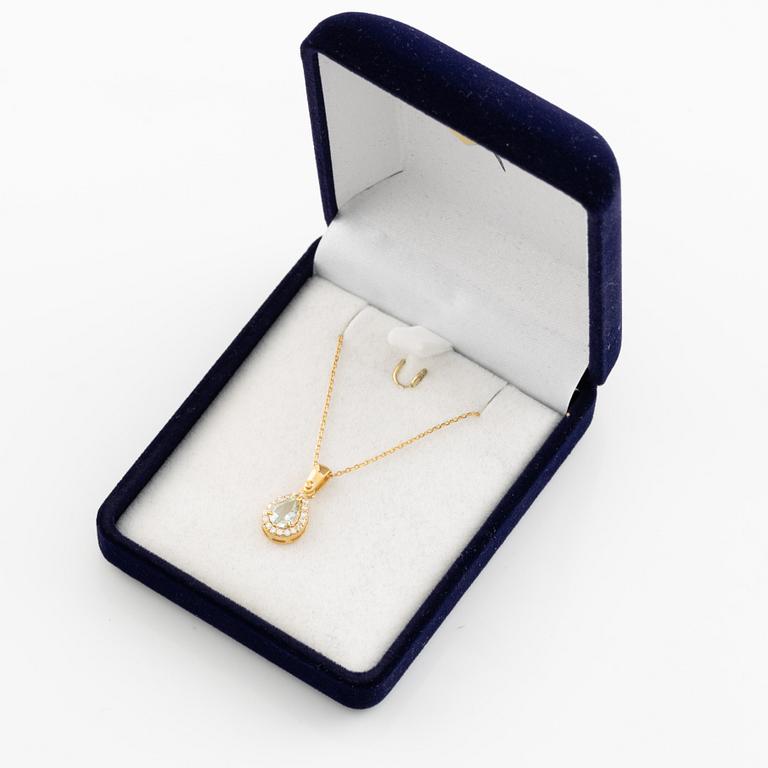 18K gold, light aquamarine and brilliant cut diamond necklace.
