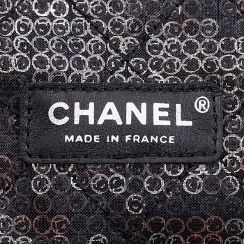 CHANEL, a black and silver tinsel evening "Flap-bag".