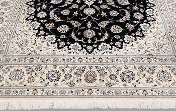 A Nain part silk carpet, 310 x 204 cm.