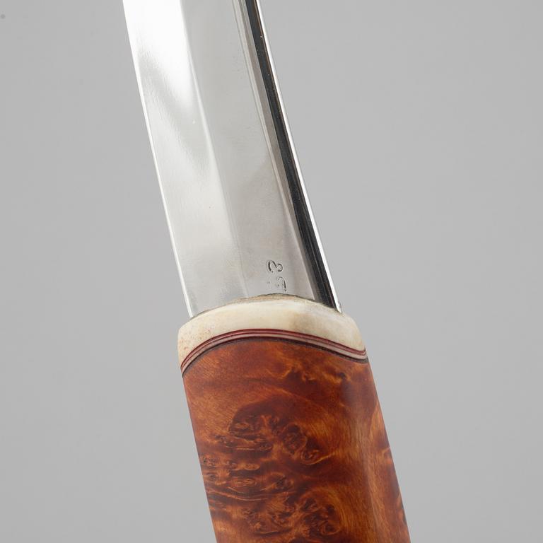 Erik Fankki, a reindeer horn knife, signed and dated 2004.