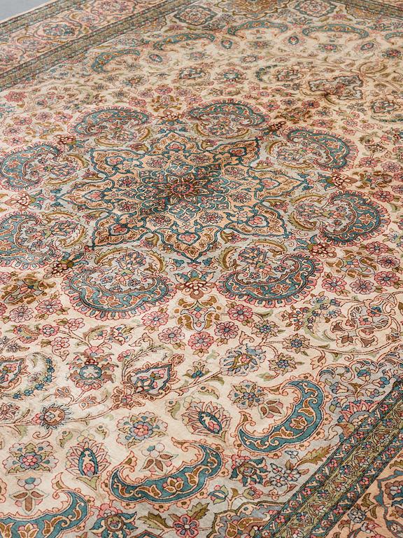 A CARPET, an old silk Turkey, ca 428 x 299-307 cm.