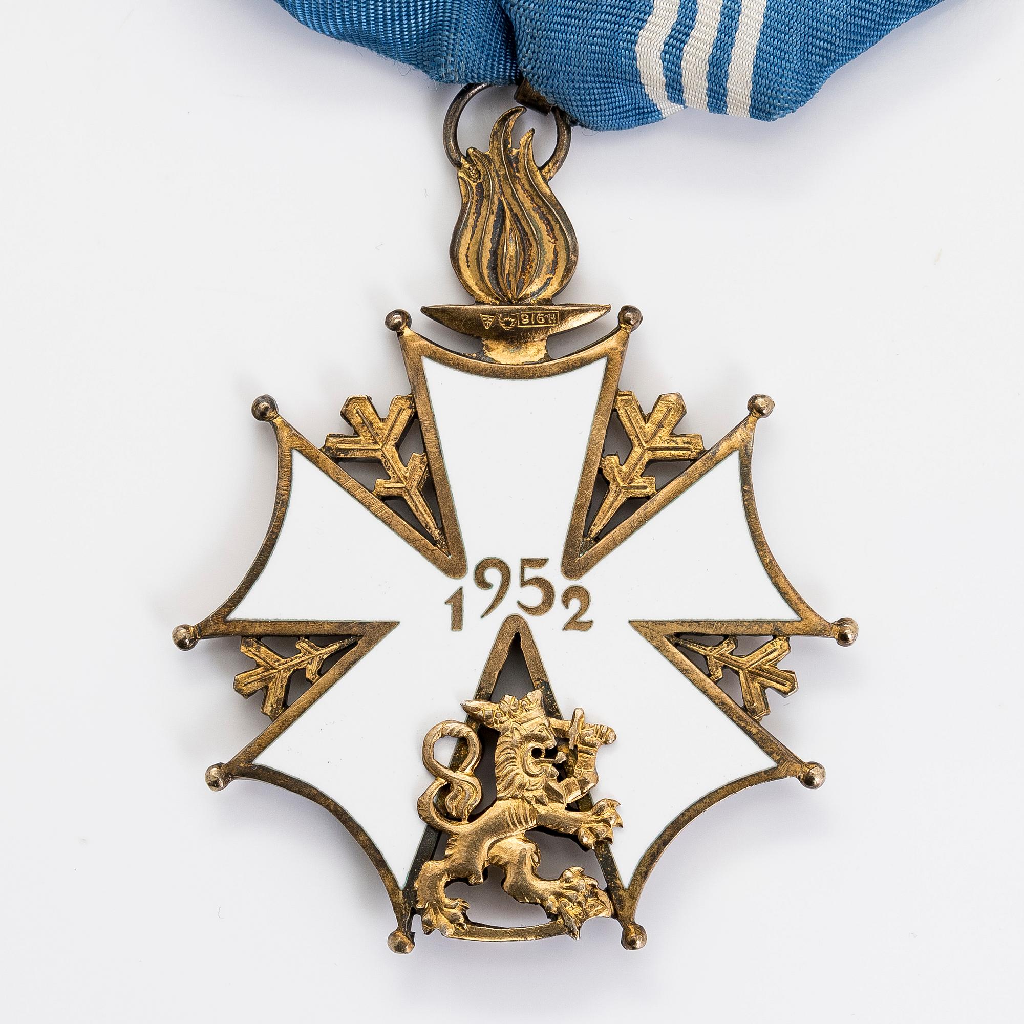 The Finnish olympic cross, 1st class, silver and enamel. Tillander, Helsinki and a Guest of Honor pin.