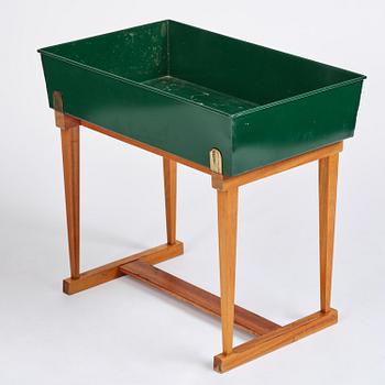 Josef Frank, a rare flower table with green lacquered box model B 2084, Firma Svenskt Tenn, 1950-60s.