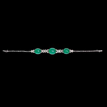 A cabochon cut emerald and diamond bracelet, tot. app. 0.80 cts.