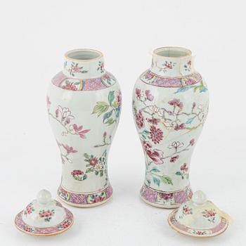 A set of three famille rose vases with covers and a bottle, Qing dynasty, Qianlong (1736-95).