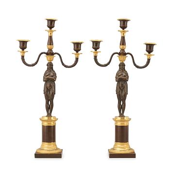 1611. A pair of Empire early 19th century three-light candelabra.