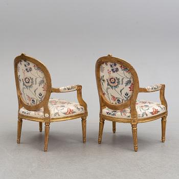 Two matched Gustavian late 18th century armchairs.