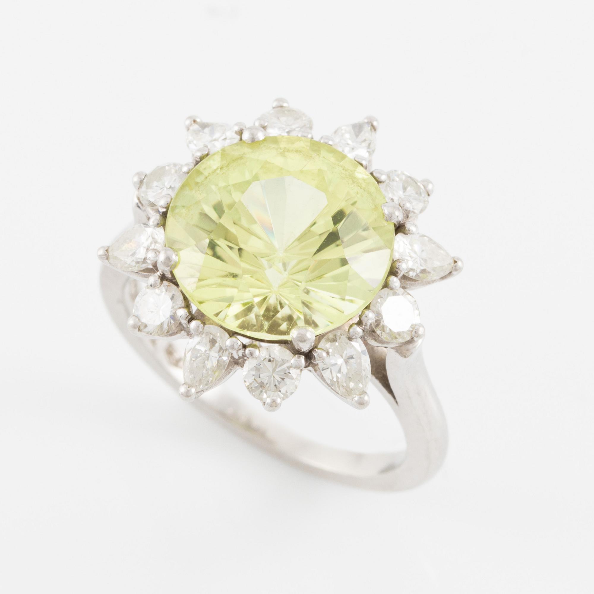 Ring, in the form of a flower, platinum with chrysoberyl and drop-cut and brilliant-cut diamonds.