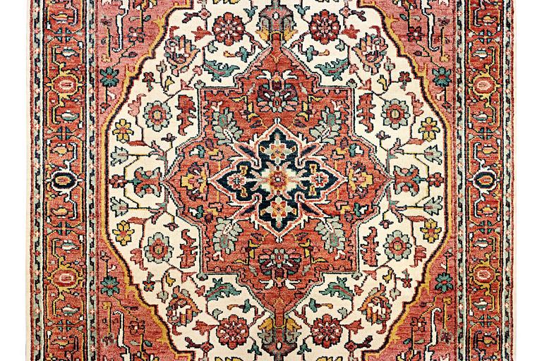An oriental carpet with Mamluk design, c. 367 x 280 cm.