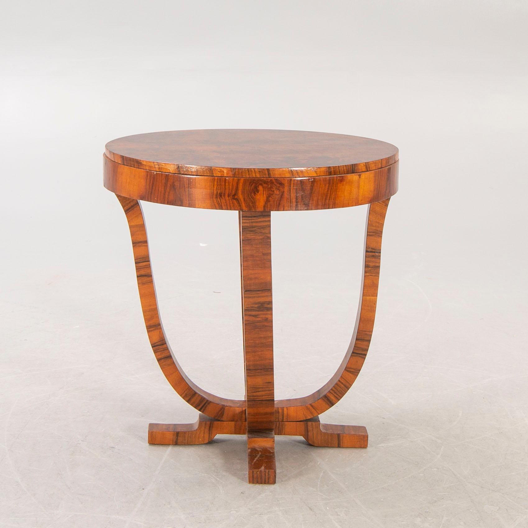 An Art Deco walnut coffee table first half of the 20th century.