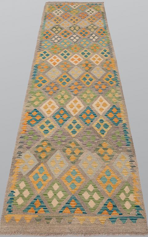 A Kilim runner, approx. 291 x 89 cm.