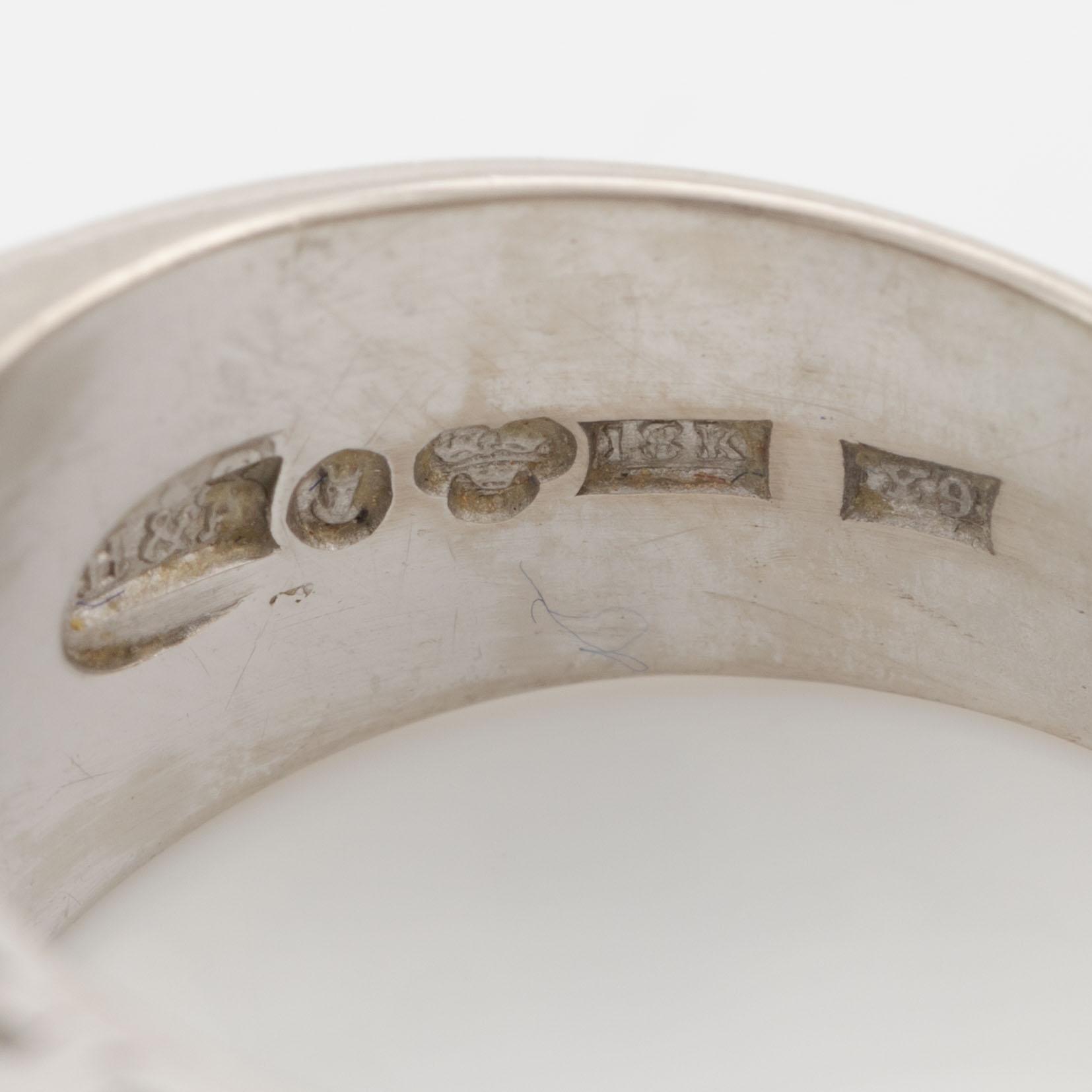 Ring, Hellström & Åhrling. 18K white gold with an emerald and old-cut and brilliant-cut diamonds.