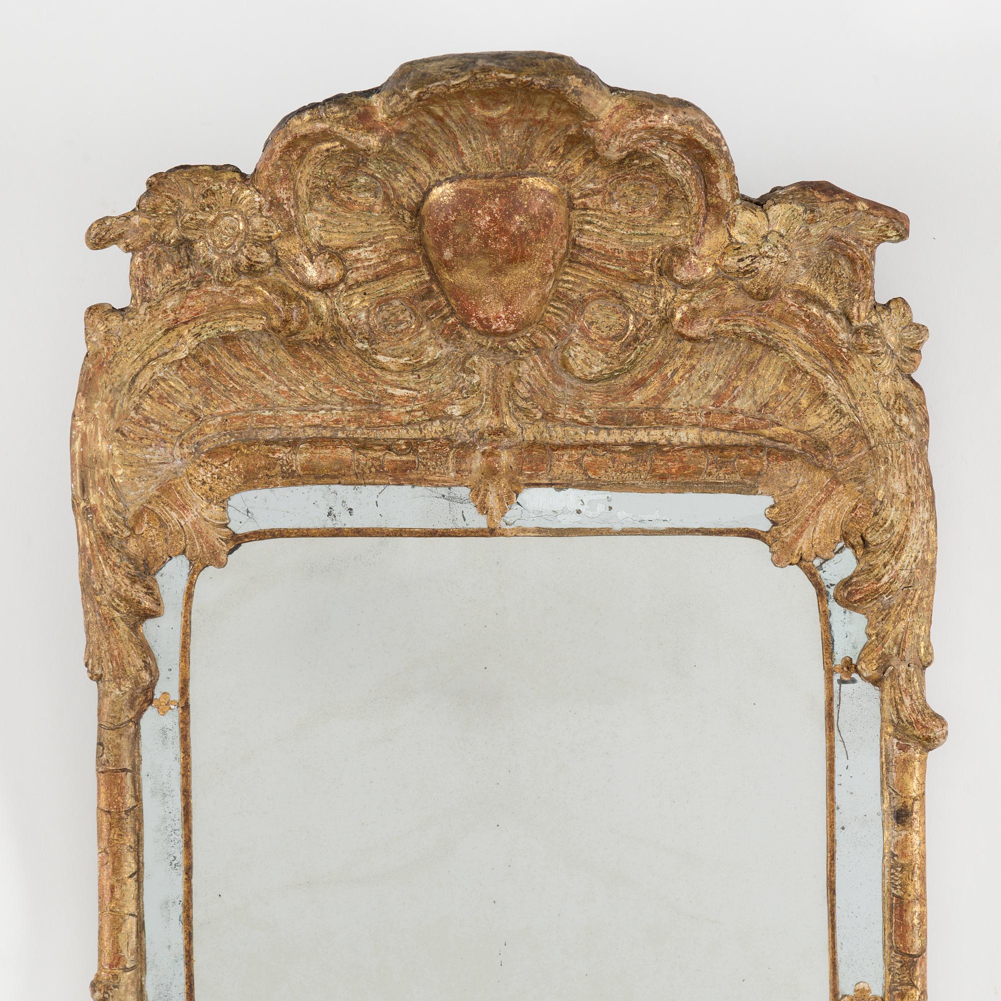 A second half of the 18th century rococo mirror sconce.