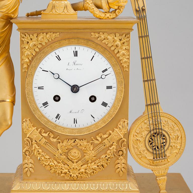An Empire table clock, dial marked "L Ravrio Bronzier à Paris Mesnil H", fist half of the 20th century.
