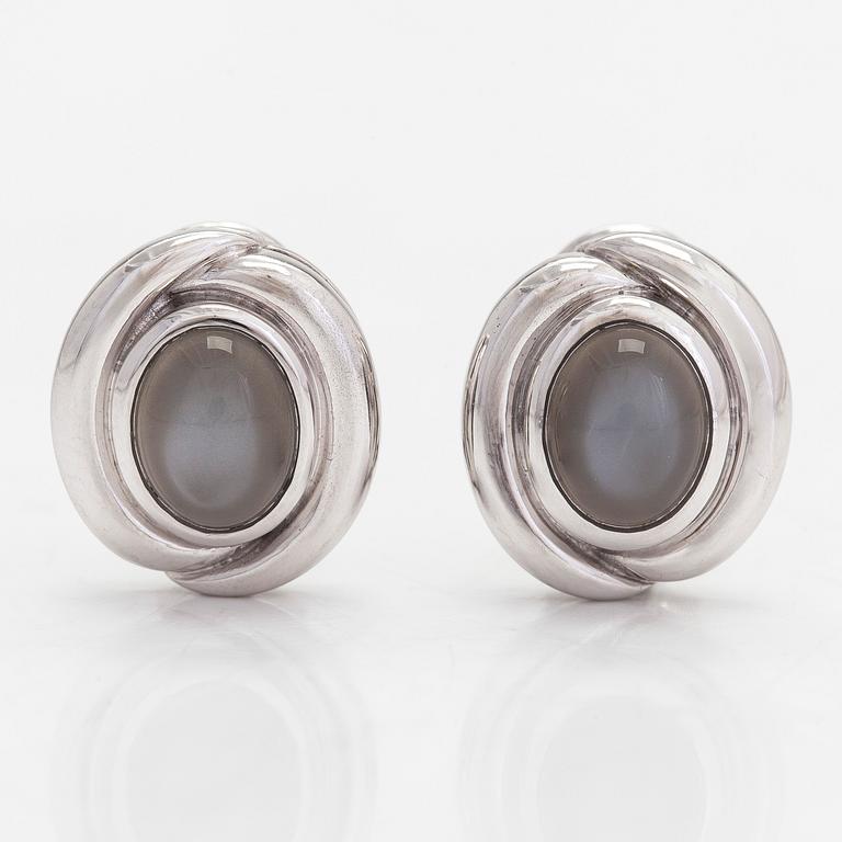 Earrings, 18K white gold with oval cabochon-cut moonstone, Gallopin & Cie, Geneva.