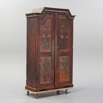A Swedish painted cupboard dated 1863.