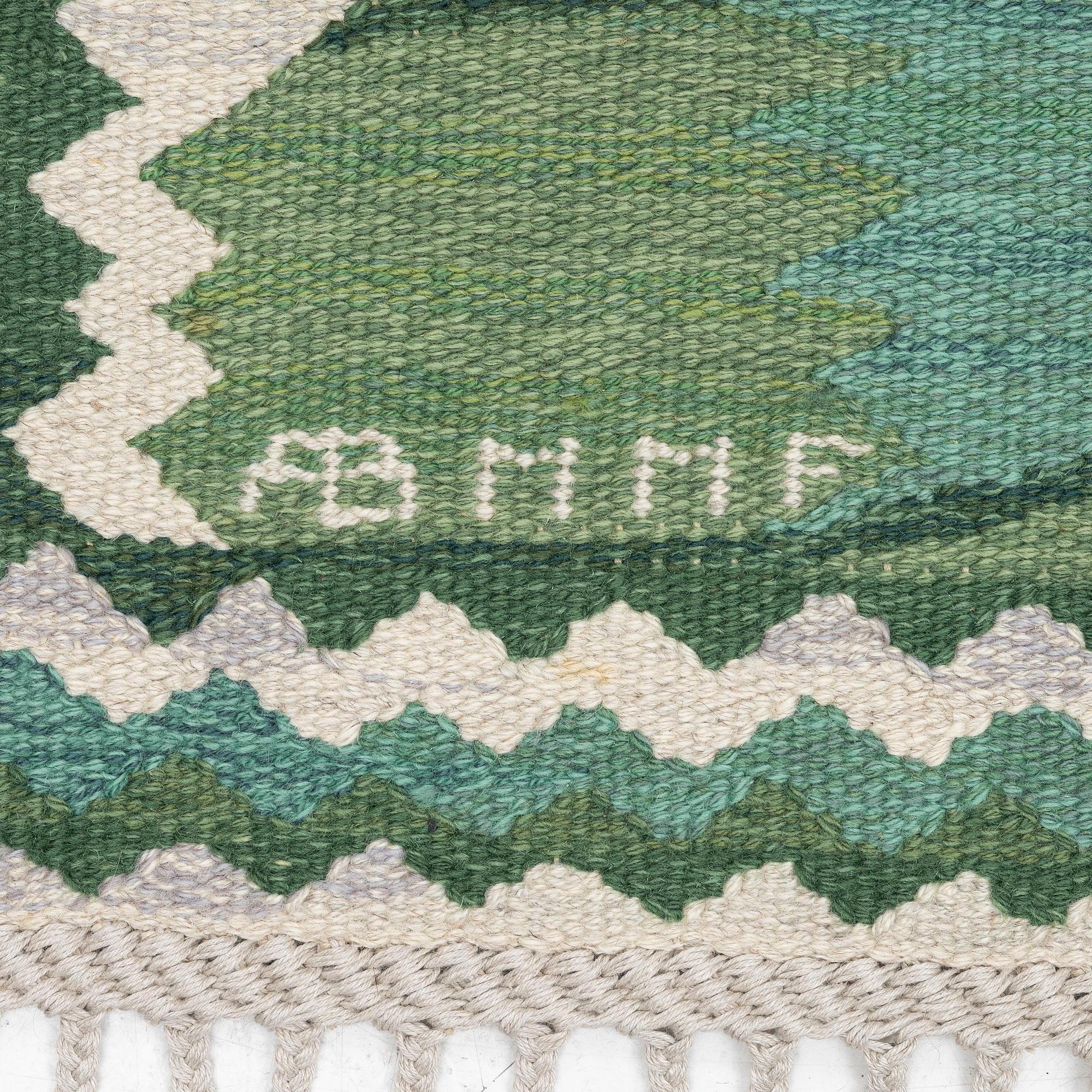 Barbro Nilsson, a carpet, 'Strålblomman grön', tapestry weave, c. 316 x 232 cm, signed AB MMF BN.
