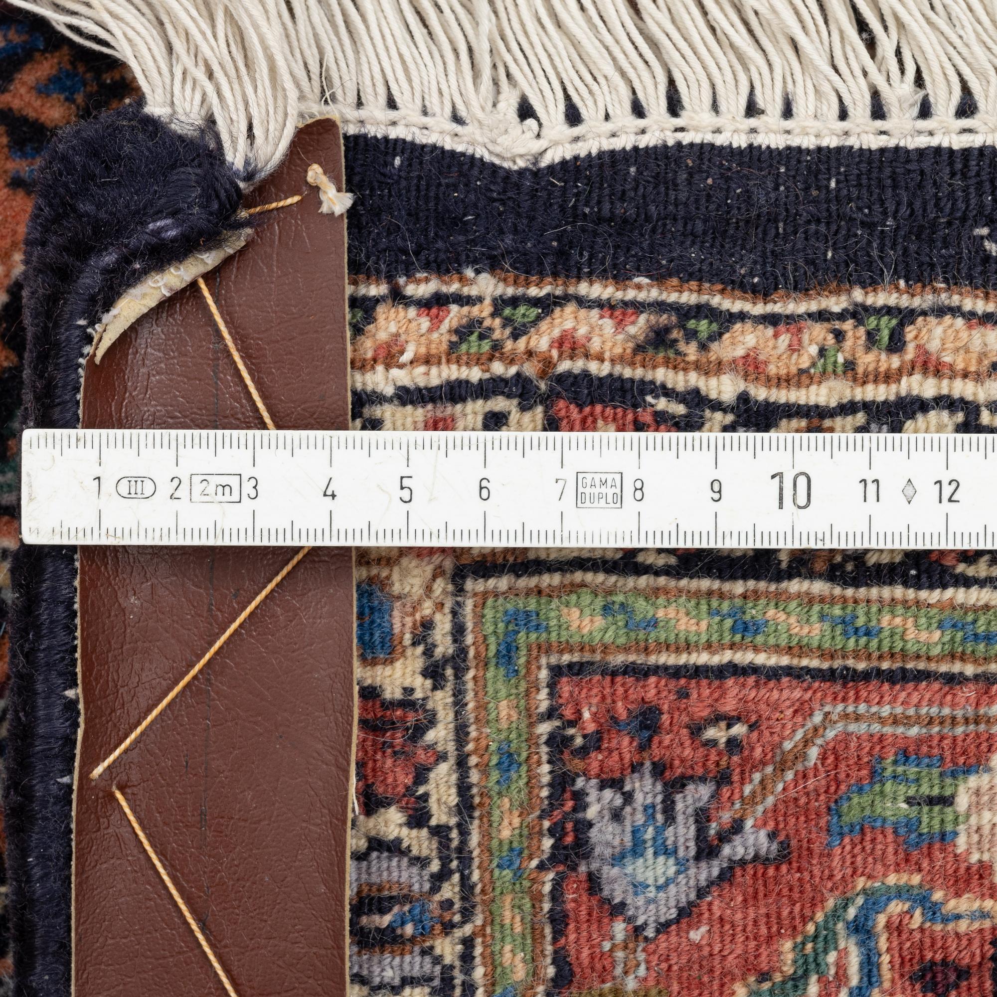 An oriental rug, approx. 203 x 135 cm.