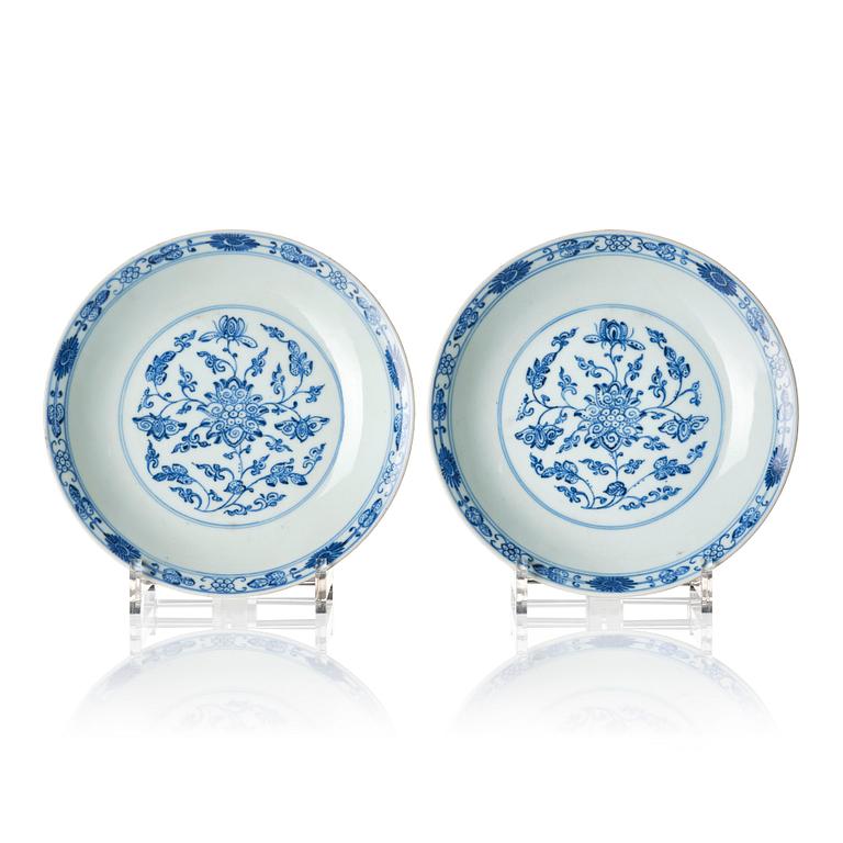 A pair of blue and white lotus dishes, Qing dynasty, Qianlong seal mark and of the period (1736-95).