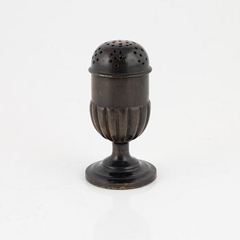 A 18th Century horn saltshaker.
