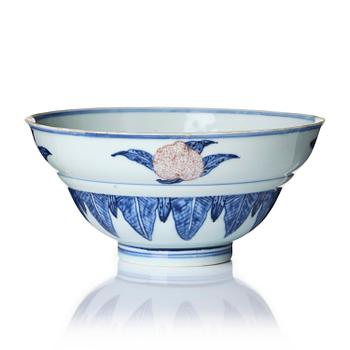 1142. A blue and white and copper-red 'peaches' bowl, Qing dynasty.