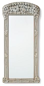 292. Ragnar Östman, attributed to, a sculptured frame Art Nouveau wall mirror, early 20th century.