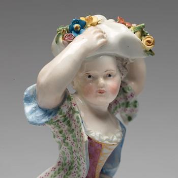 A Meissen figure of a girl with flowers, 1890's.