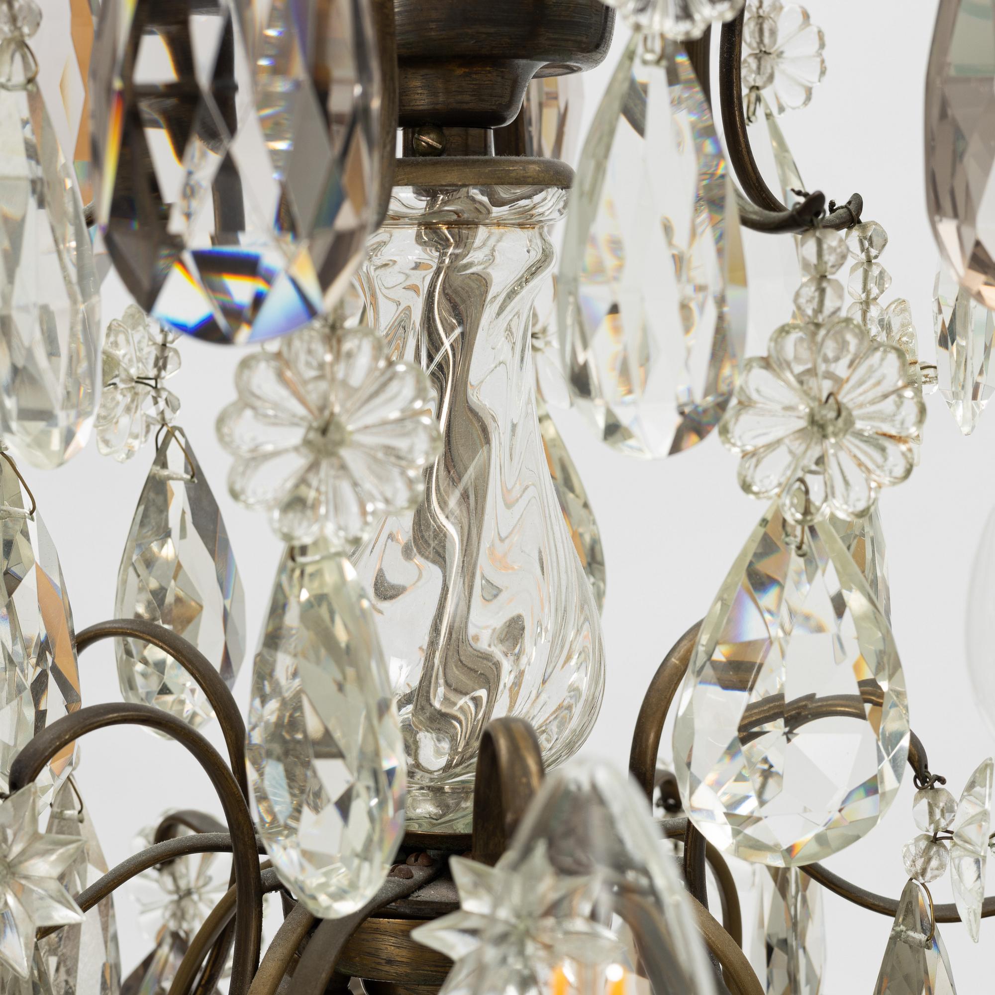 Takkrona, rokokostil, 1900-talets första hälft.