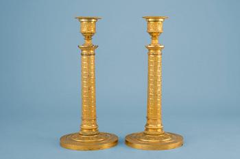 267. A PAIR OF EMPIRE CANDLESTICKS.