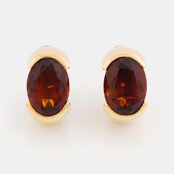 423A. A pair of Tina Karlsson earrings in 18K gold set with faceted citrines.