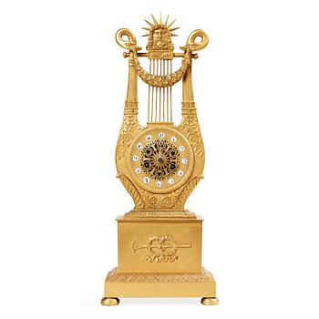 A French Empire early 19th century gilt bronze mantel clock.