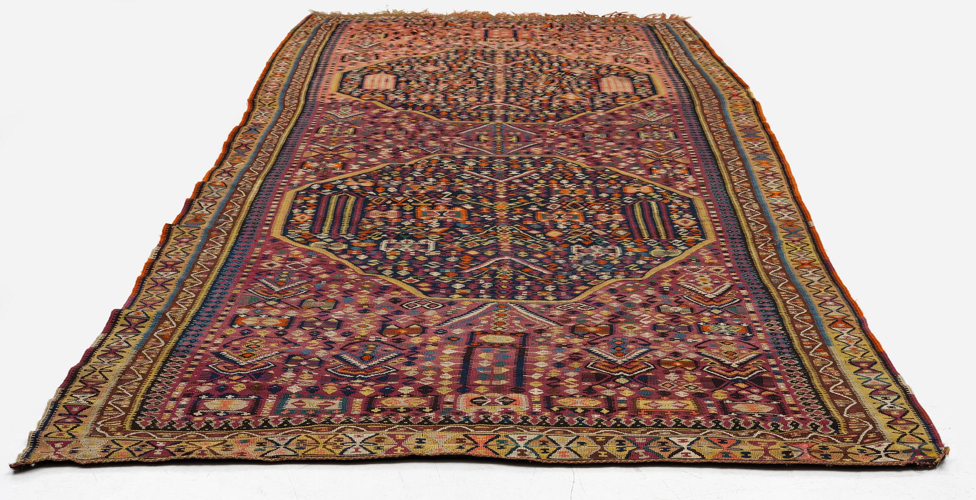 An antique kilim, southeastern Anatolia/Caucasus, c. 398 x 176 cm.