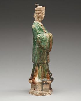 A green glazed pottery figure of a dignitary, Ming dynasty (1368-1644).