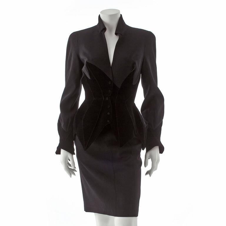 THIERRY MUGLER, a two-piece black wool and velvet dress consisting of jacket and skirt.