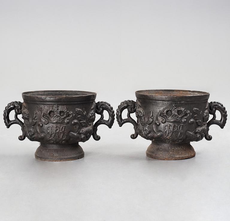 A pair of Swedish cast iron plant pot with the monogram of Queen Hedvig Eleonora, probably 1920's.