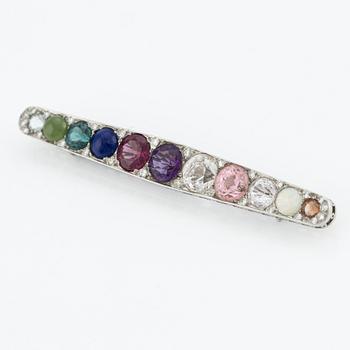 Brooch, platinum with gemstones and diamonds.