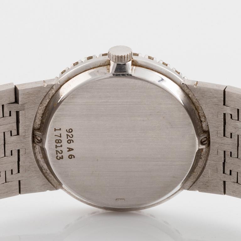 A Piaget 18K white gold wrist watch set with round brilliant-cut diamonds.