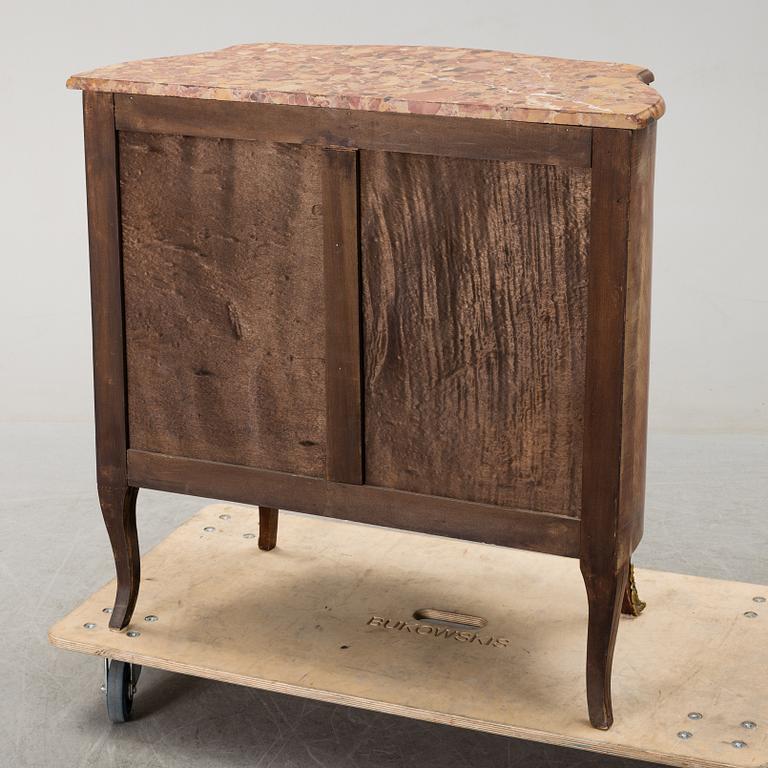 A rococo style chest of drawers.