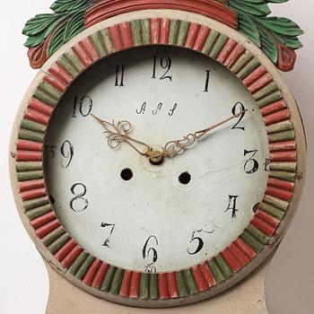 a painted wall pendulum clock from Ångermanland in the first half of the 19th century.