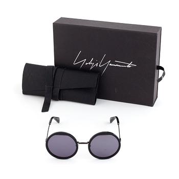 A pair of Yohji Yamamoto sunglasses.