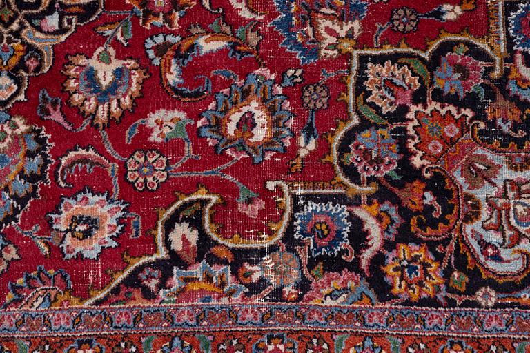 An Oriental carpet, approx. 380 x 304 cm.