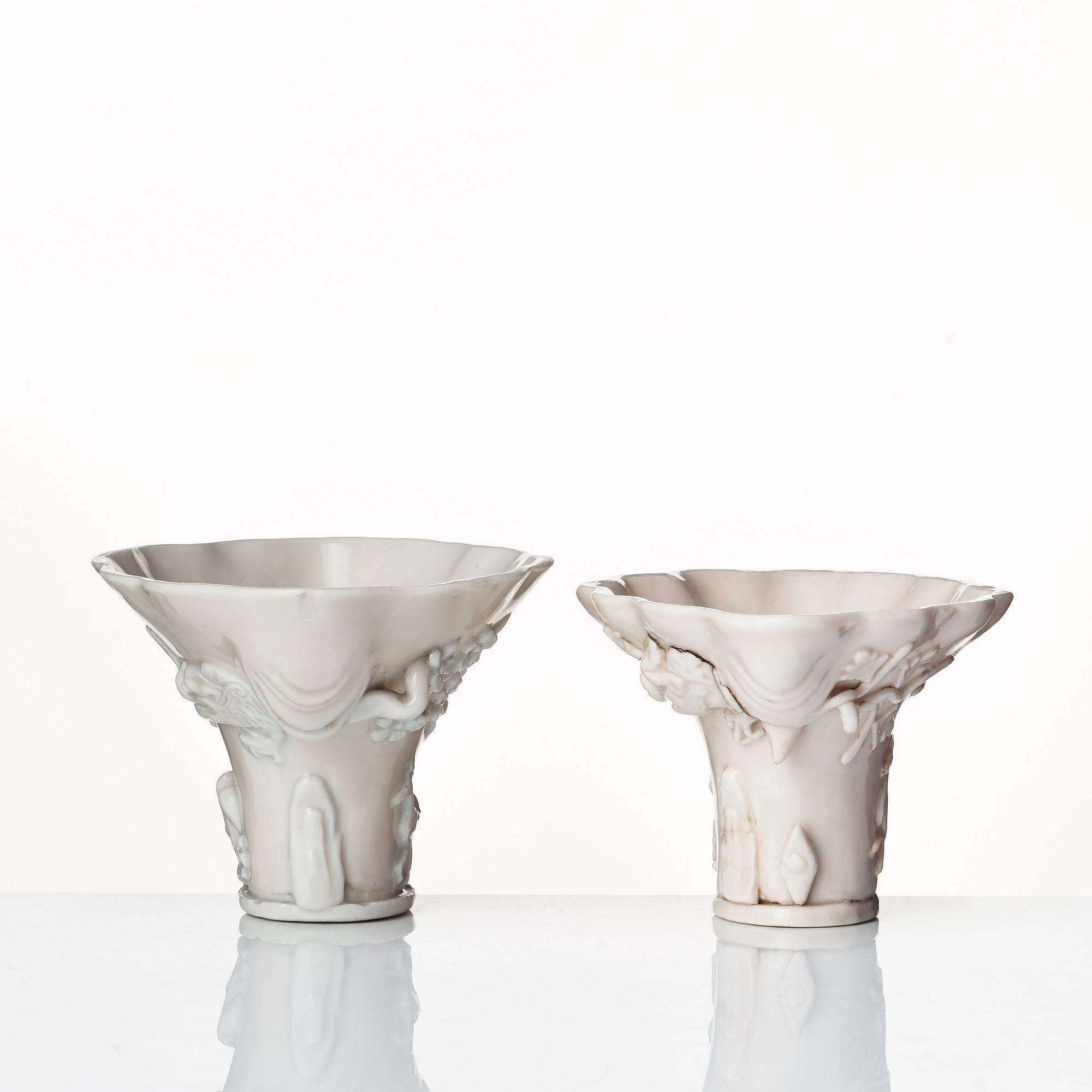Two blanc de chine rhinoserous shaped libation cups, Qing dynasty, Kangxi (1662-1722).