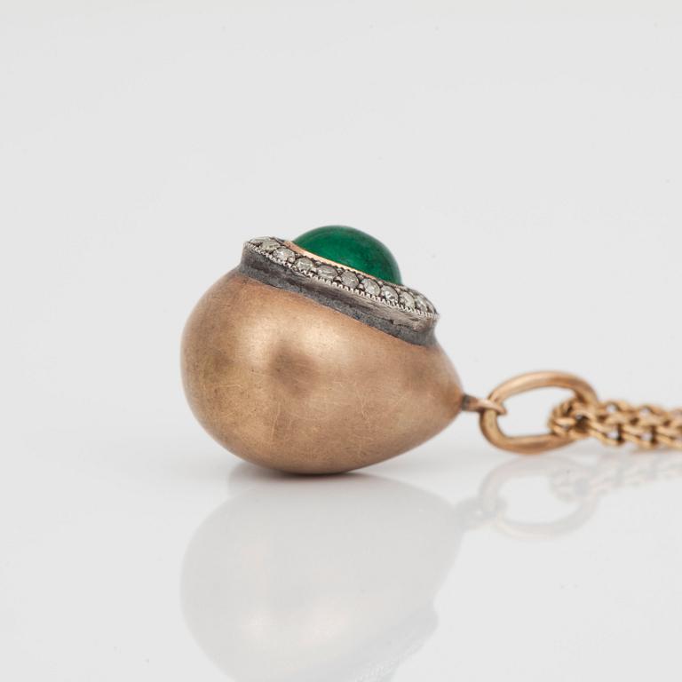 A necklace with a pendant in the shape of an egg set with an emerald and diamonds. Russia 1899 - 1908.