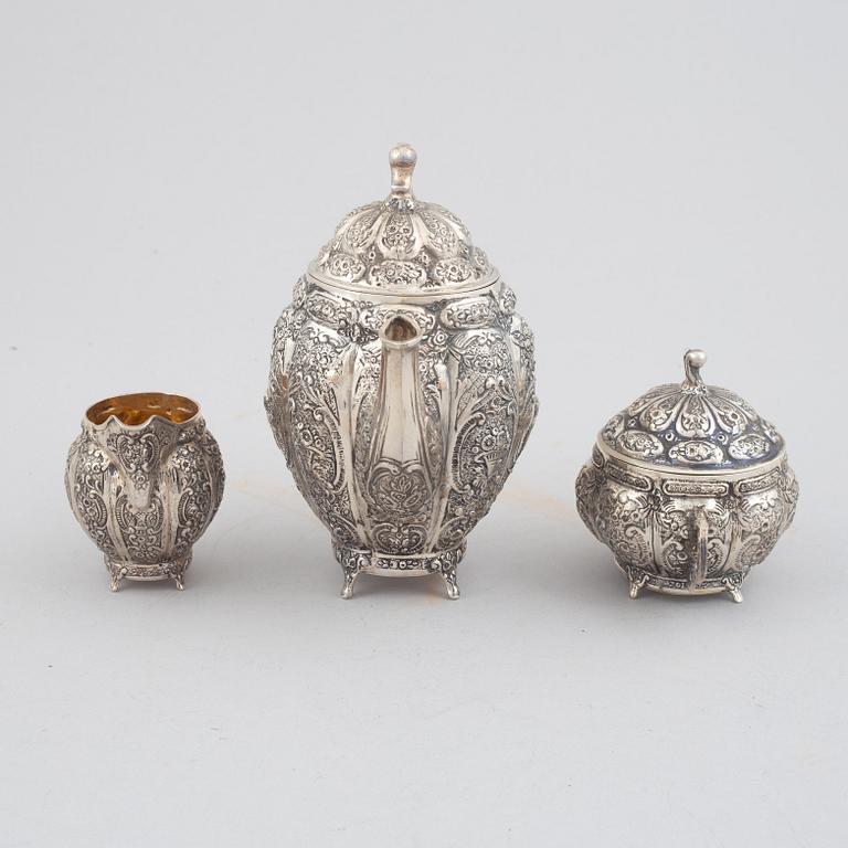 E.Jäntti, four silver cups, a three-piece silver coffee service and a silver tray, Helsinki, Finland,1979-81.